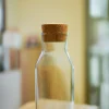 small glass bottles with cork