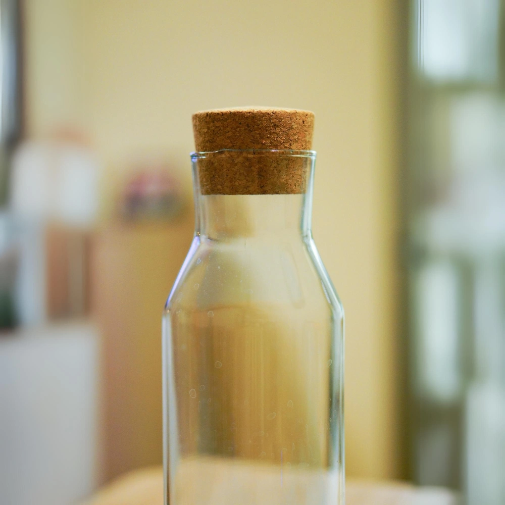 small glass bottles with cork